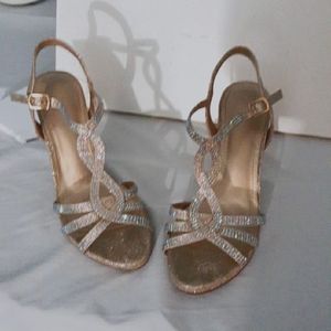 These shoes are from Dream Pairs. They are size 8. They are silver and gold